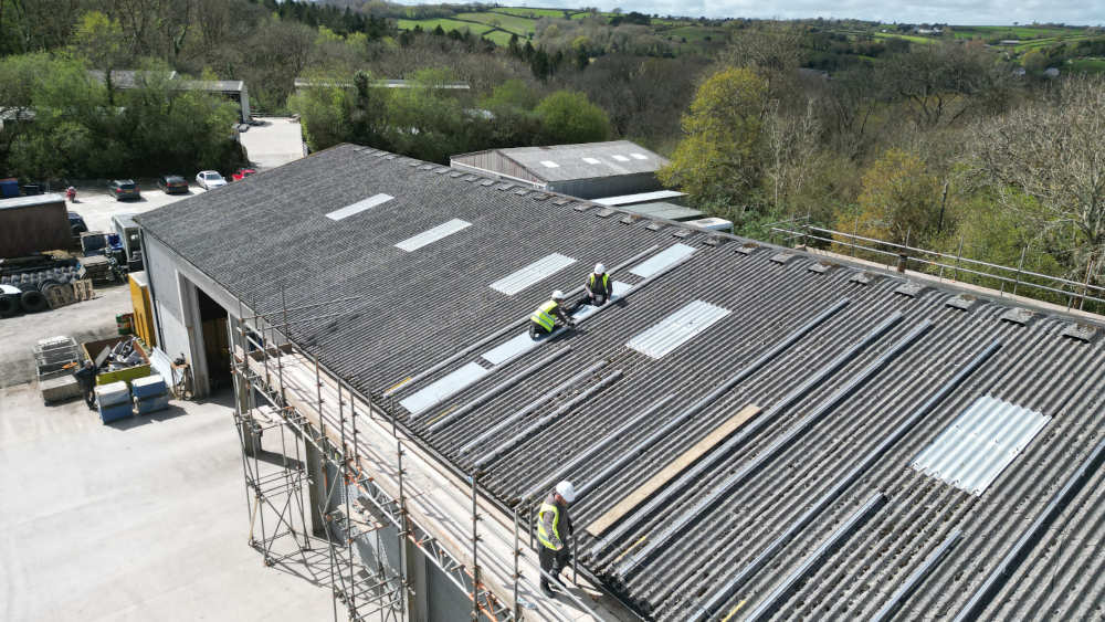 Using boards to safely install solar roof mounts on asbestos roof